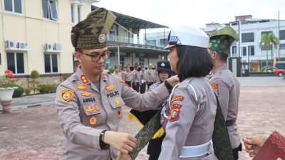Kapolresta Pekanbaru Pimpin Apel Launching Penggunaan Tanjak dan Selempang Bersama LAM Riau