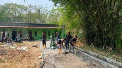 Satgas TMMD Ke-129 Rawat Hasil Pengecoran Jalan Sasaran 6 di Desa Wibawamulya